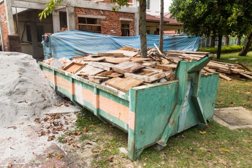 Waste removal professionals managing demolition debris