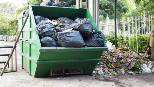 Enforcement officer inspecting a skip container in Kings Cross